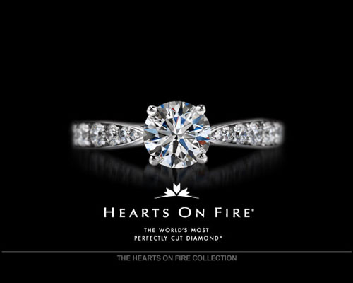 A perfect ring of eight hearts when viewed from the bottom. A perfectly formed symmetrical fireburst of light when seen from the top. Diamonds cut and polished at 100X magnification - 10 times the industry standard. That's the perfection of a Hearts On Fire diamond. It's a perfection you can see. Hearts On Fire, The World's Most Perfectly Cut Diamond