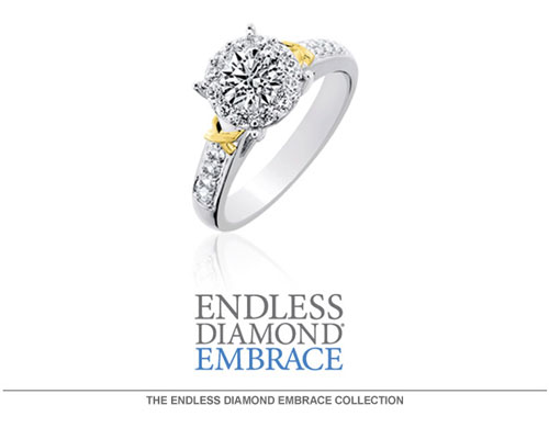Endless Diamond Embrace engagement rings utilize the Endless Diamond patented diamond setting, Touch Setting®. This innovative setting technique allows the diamonds to be invisibly set around a solitaire center diamond creating a seamless solitaire appearance. The difference in the Touch Setting technique is a tension set process that does not cut, notch or groove the diamonds. Allowing the diamonds to surround and hug the center diamond without prongs to achieve a continuous flow of diamond fire and brilliance. The result is a larger look than a single stone.