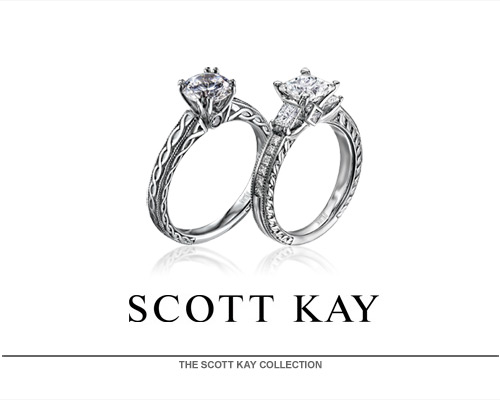 For 25 years, Scott Kay has been acclaimed the foremost authority in bridal and fine fashion jewelry. Industry polls confirm Scott Kay is the number one best-selling bridal brand. Fellow celebrities often are adorned by Scott Kay's hand-perfected fine fashion platinum designs, offered in "Art of Man" hand-woven wristwear, neckwear, cuffwear, key fobs and more. You must see and feel a Scott Kay design for yourself to truly experience the precession and intricate features within each and every hand forged selection. Scott Kay's vast popularity is due in part to an intense pas...